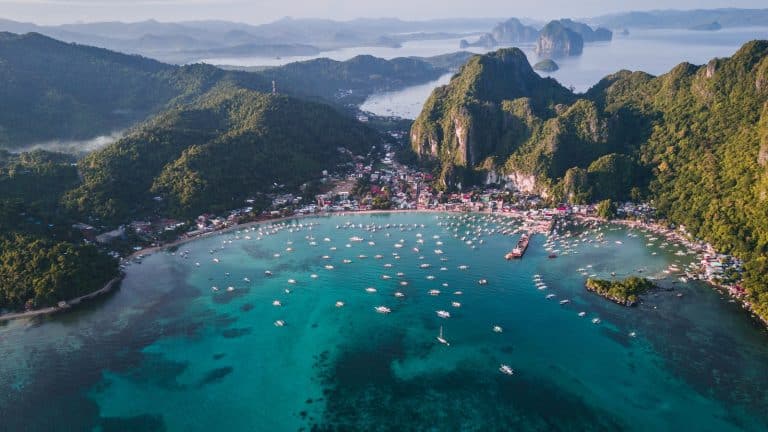 landscape photography of island with boats